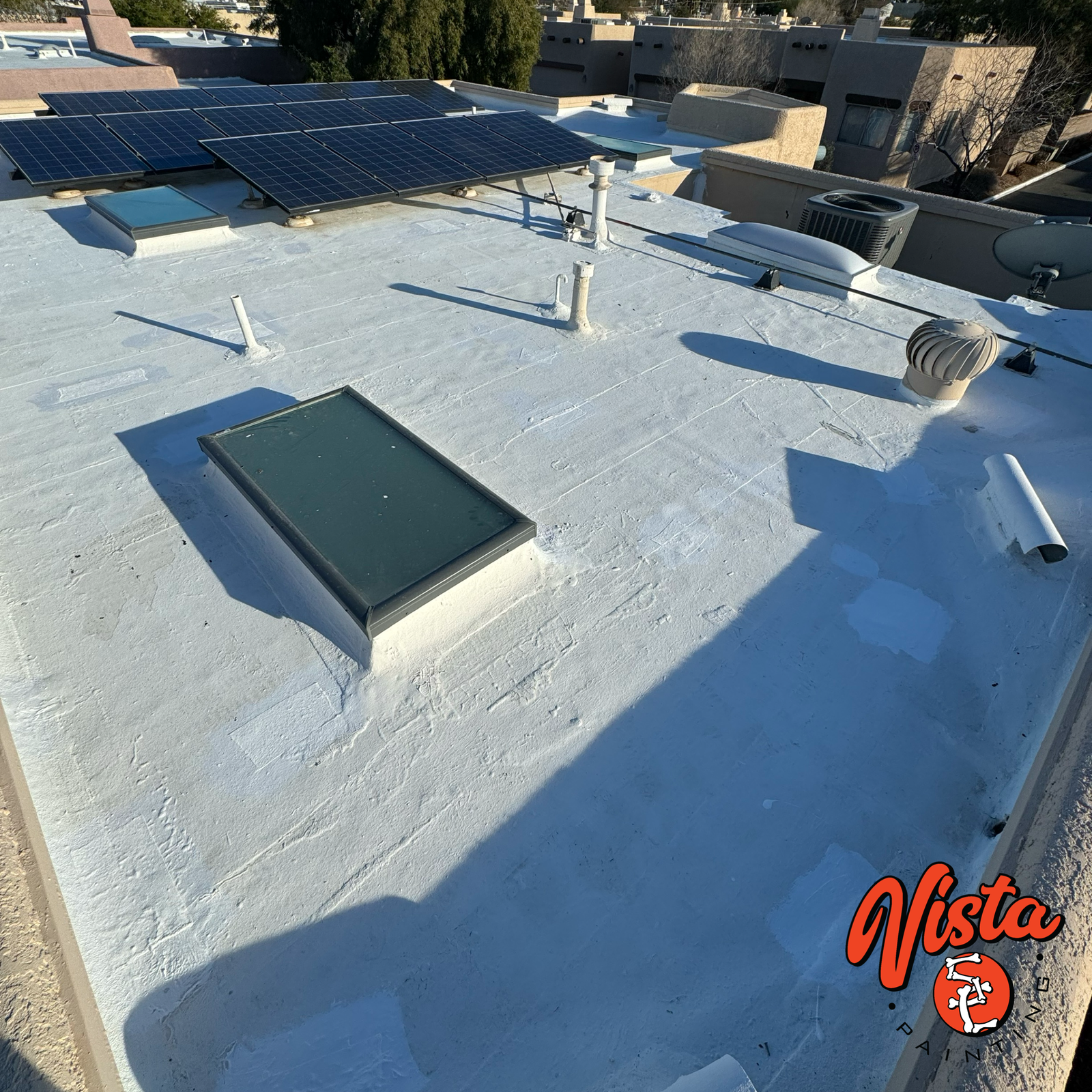 fresh white roof coating on a flat roof in Tucson, AZ skylight detail