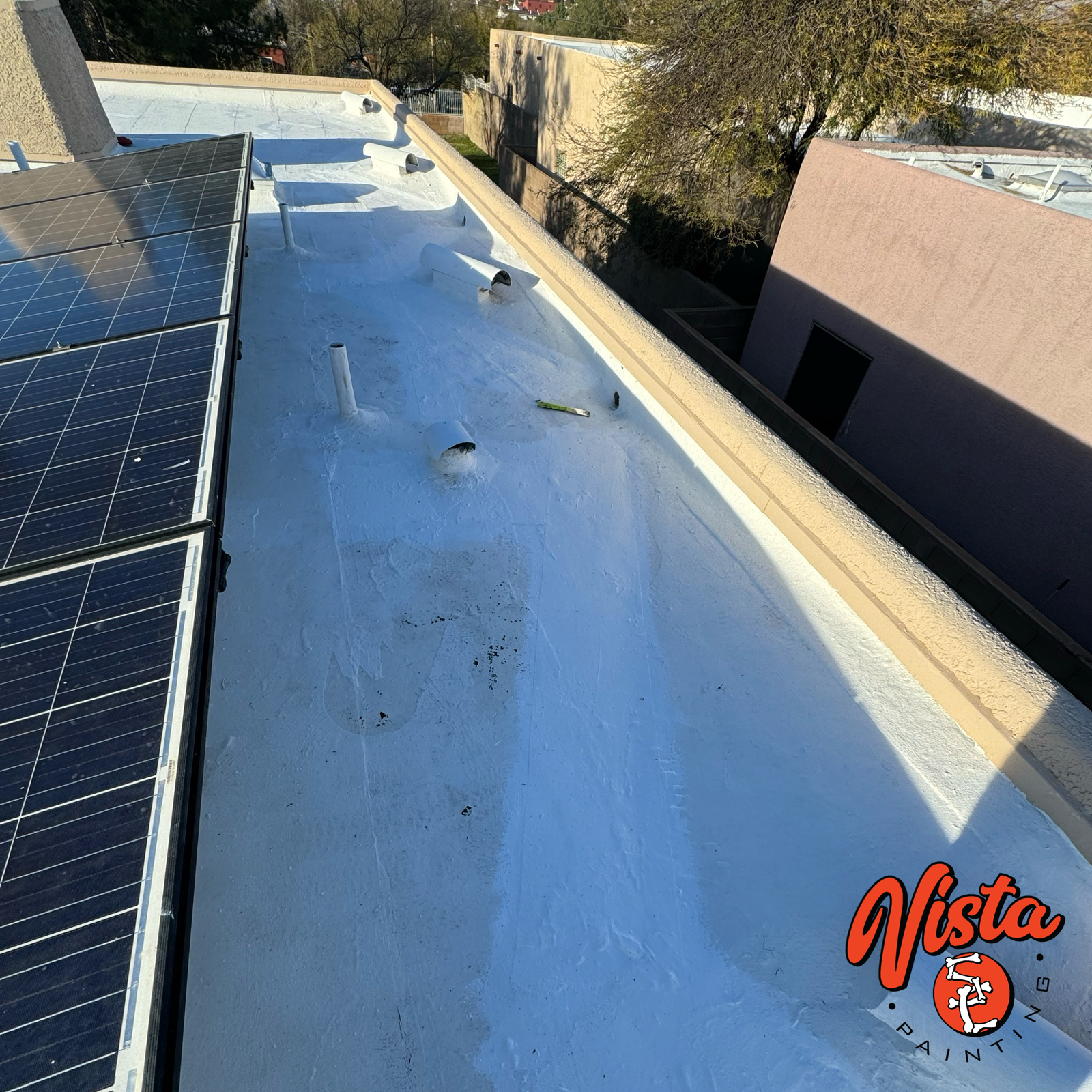 fresh white roof coating overlooking a backyard swimming pool