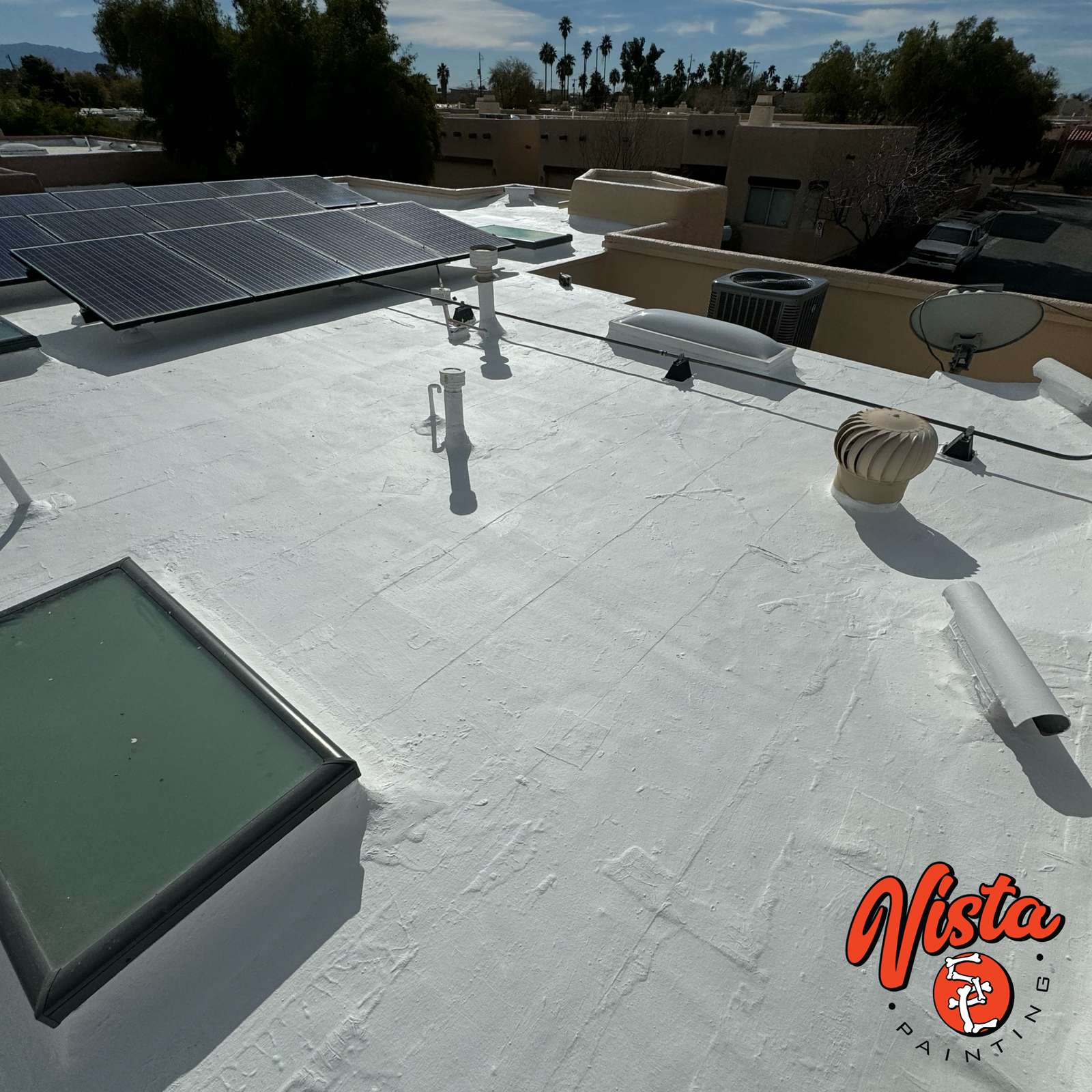 completed flat roof coating with skylight on a Tucson residential home