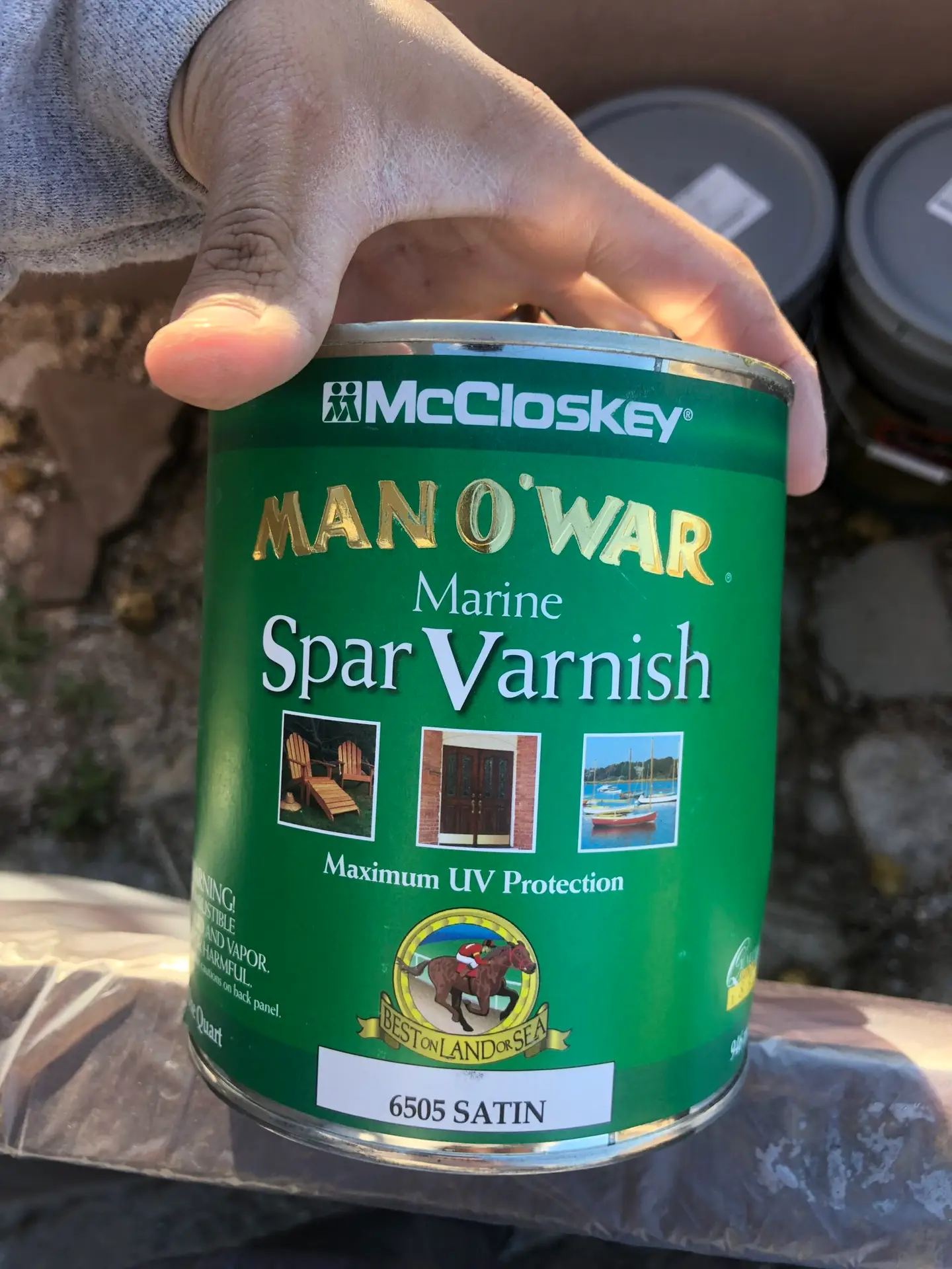 Can of Man O’ War spar varnish used for an exterior wood gate restoration in Catalina Foothills