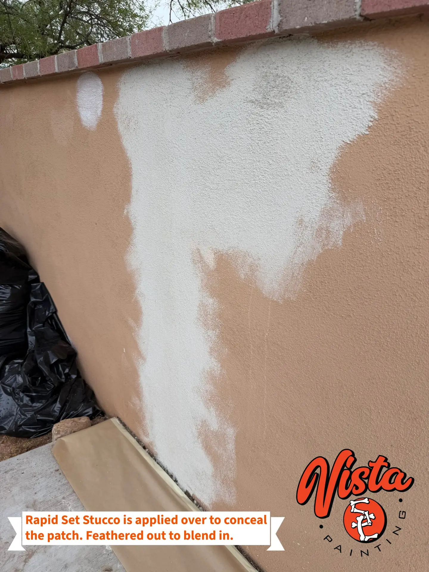 Stucco patch feathered into an exterior wall during surface preparation in Tucson, Arizona